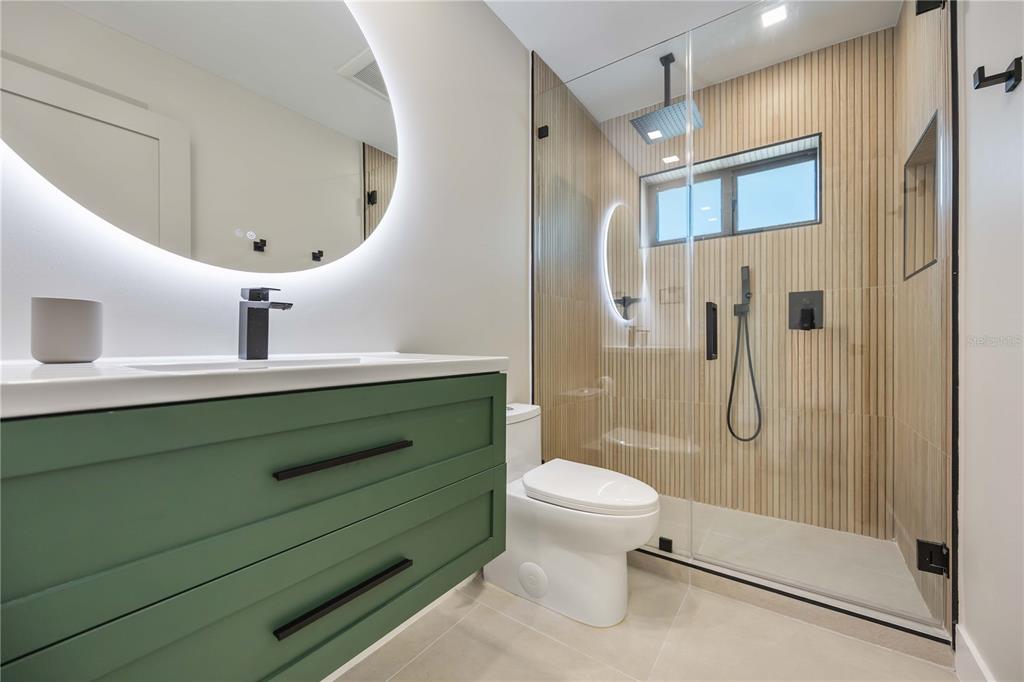 105 Sinclair Street Southeast Port Charlotte, FL 33952 - Photo 32 of 69 a bathroom with a sink a toilet and shower