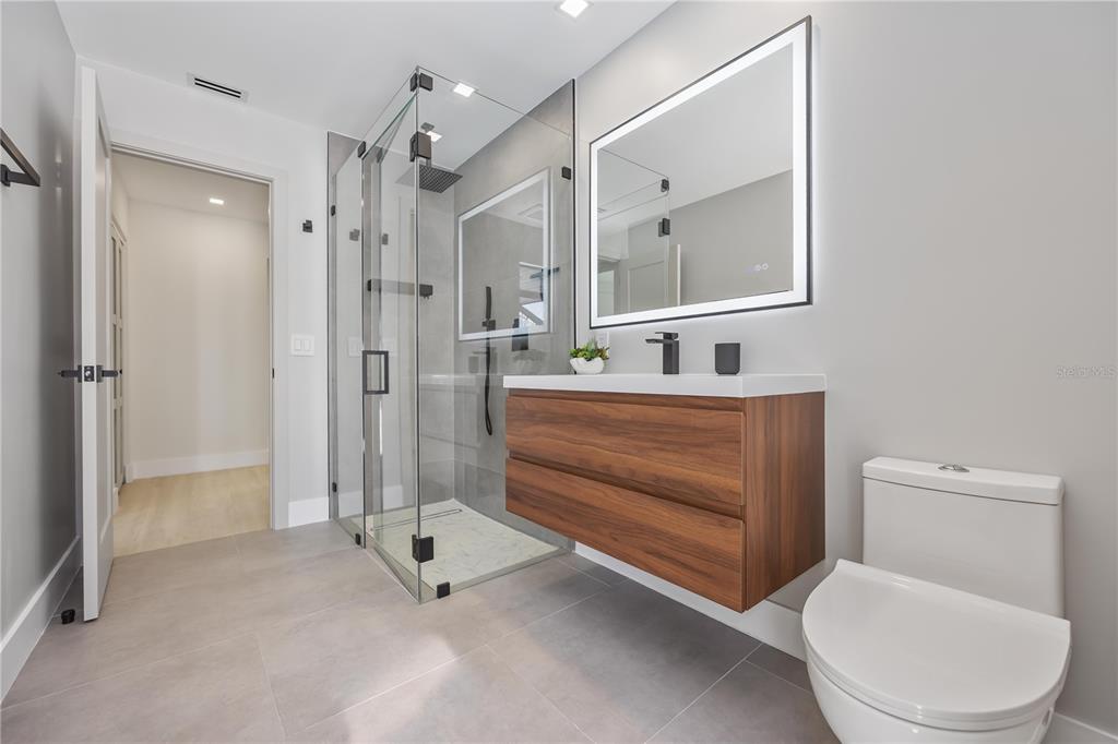 105 Sinclair Street Southeast Port Charlotte, FL 33952 - Photo 38 of 69 a bathroom with a toilet a sink and shower