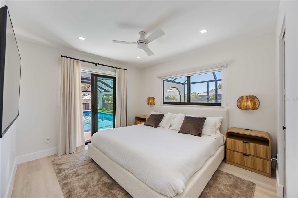 105 Sinclair Street Southeast Port Charlotte, FL 33952 - Photo 39 of 69 a bedroom with a large bed and a window