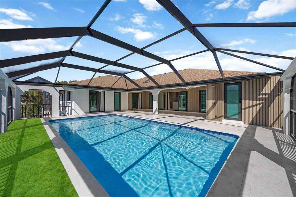 105 Sinclair Street Southeast Port Charlotte, FL 33952 - Photo 7 of 69 a view of house with backyard and sitting area