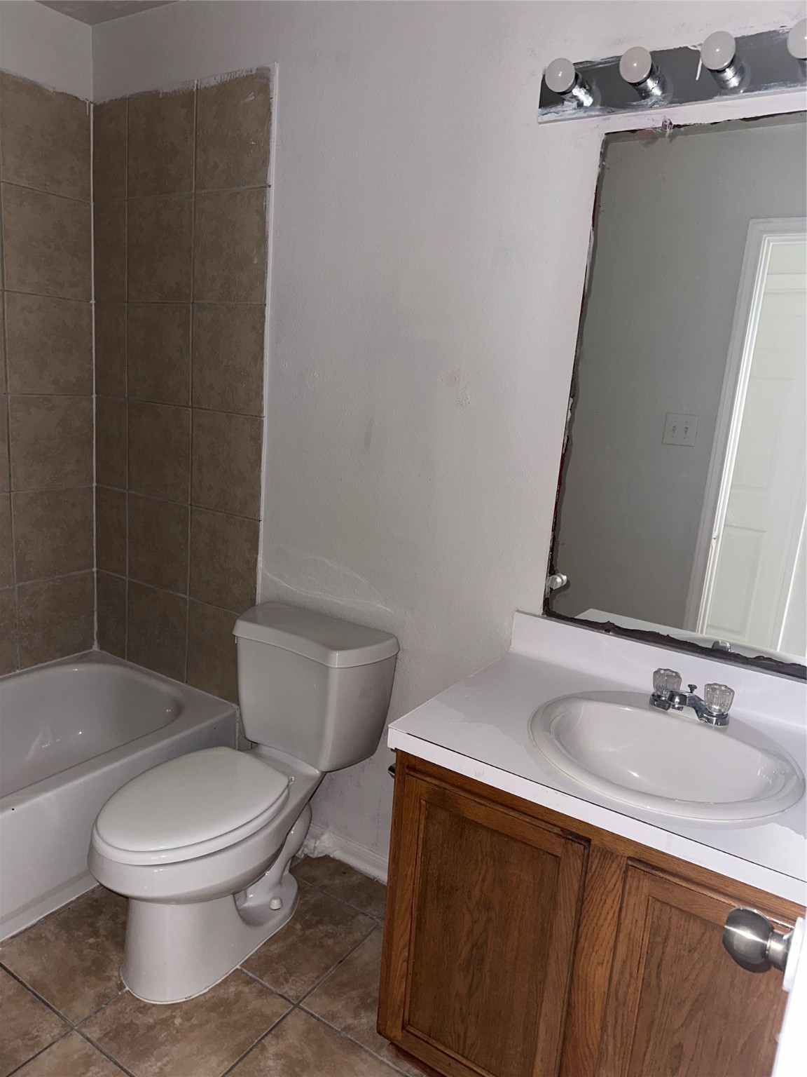 15931 Winston Point Lane Houston, TX 77084 - Photo 12 of 26 a white toilet sitting next to a bathroom sink