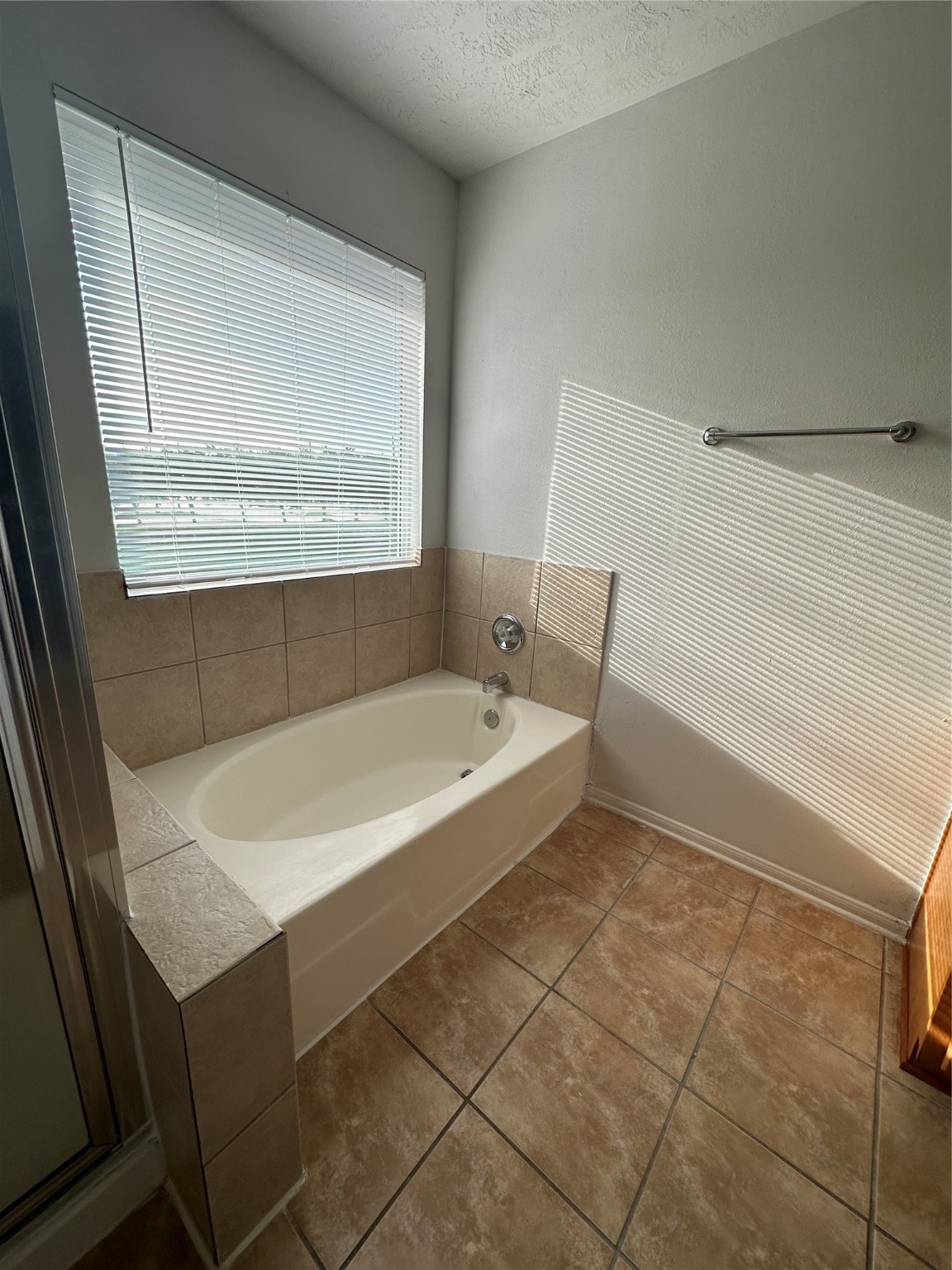 15931 Winston Point Lane Houston, TX 77084 - Photo 16 of 26 a bathroom with a bathtub and a shower