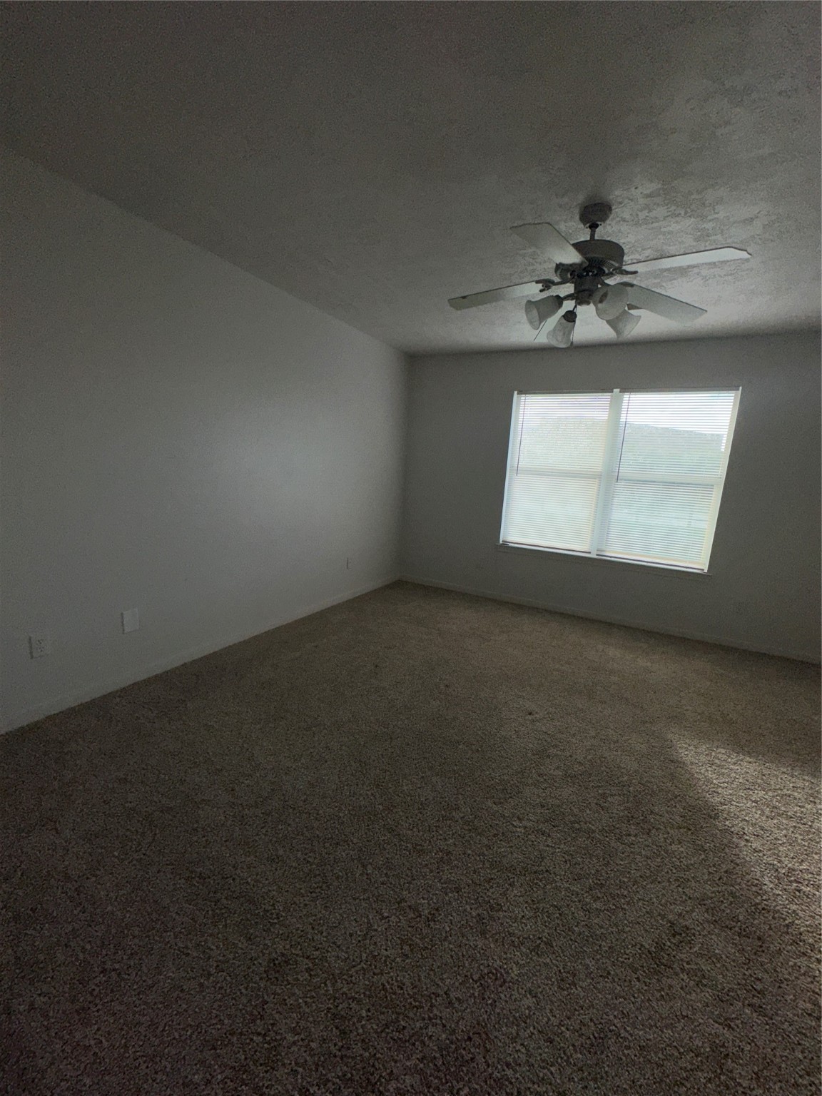 15931 Winston Point Lane Houston, TX 77084 - Photo 17 of 26 an empty room with a empty space and windows