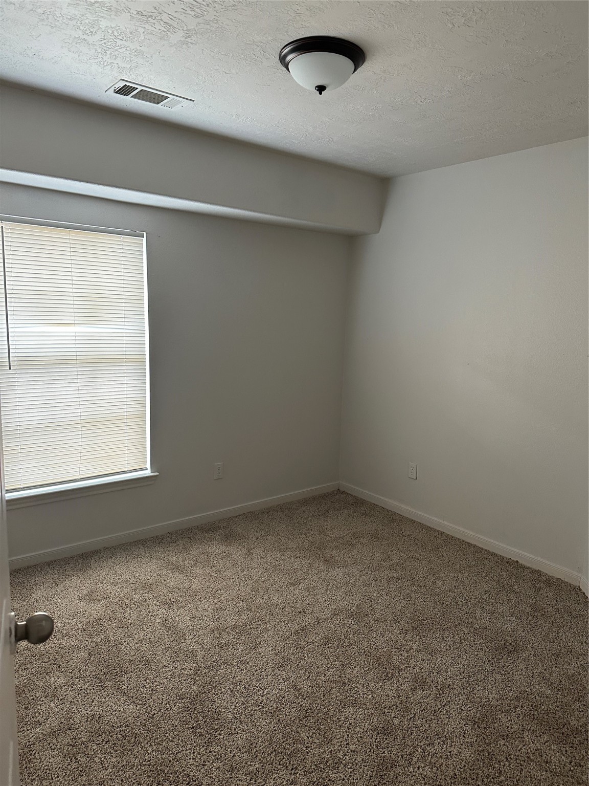 15931 Winston Point Lane Houston, TX 77084 - Photo 18 of 26 an empty room with a empty space and windows