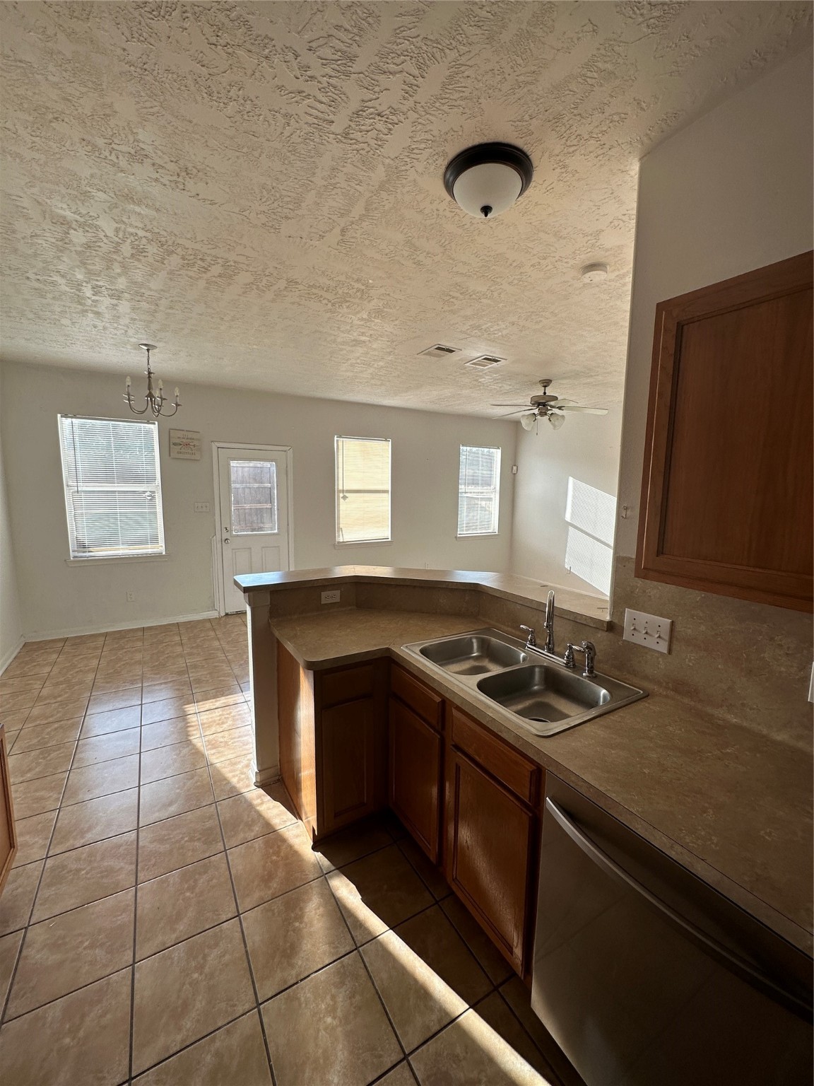 15931 Winston Point Lane Houston, TX 77084 - Photo 3 of 26 a kitchen with a sink and a stove top oven