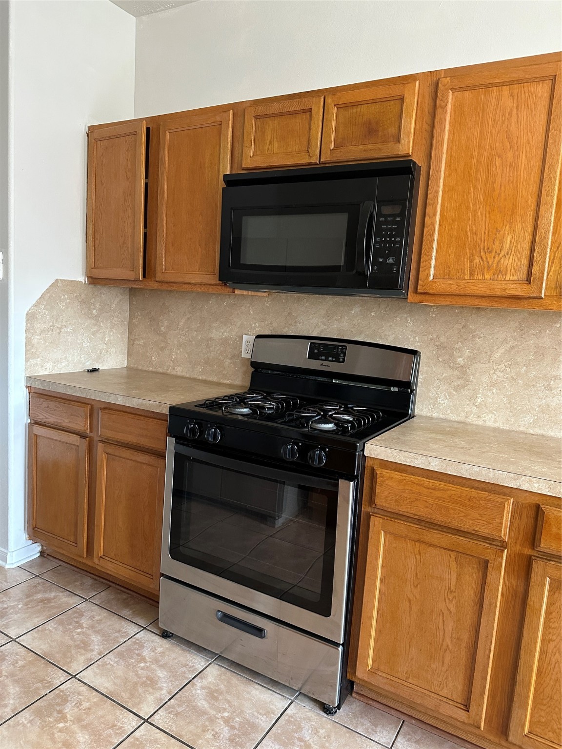 15931 Winston Point Lane Houston, TX 77084 - Photo 6 of 26 a kitchen with granite countertop cabinets and steel stainless steel appliances