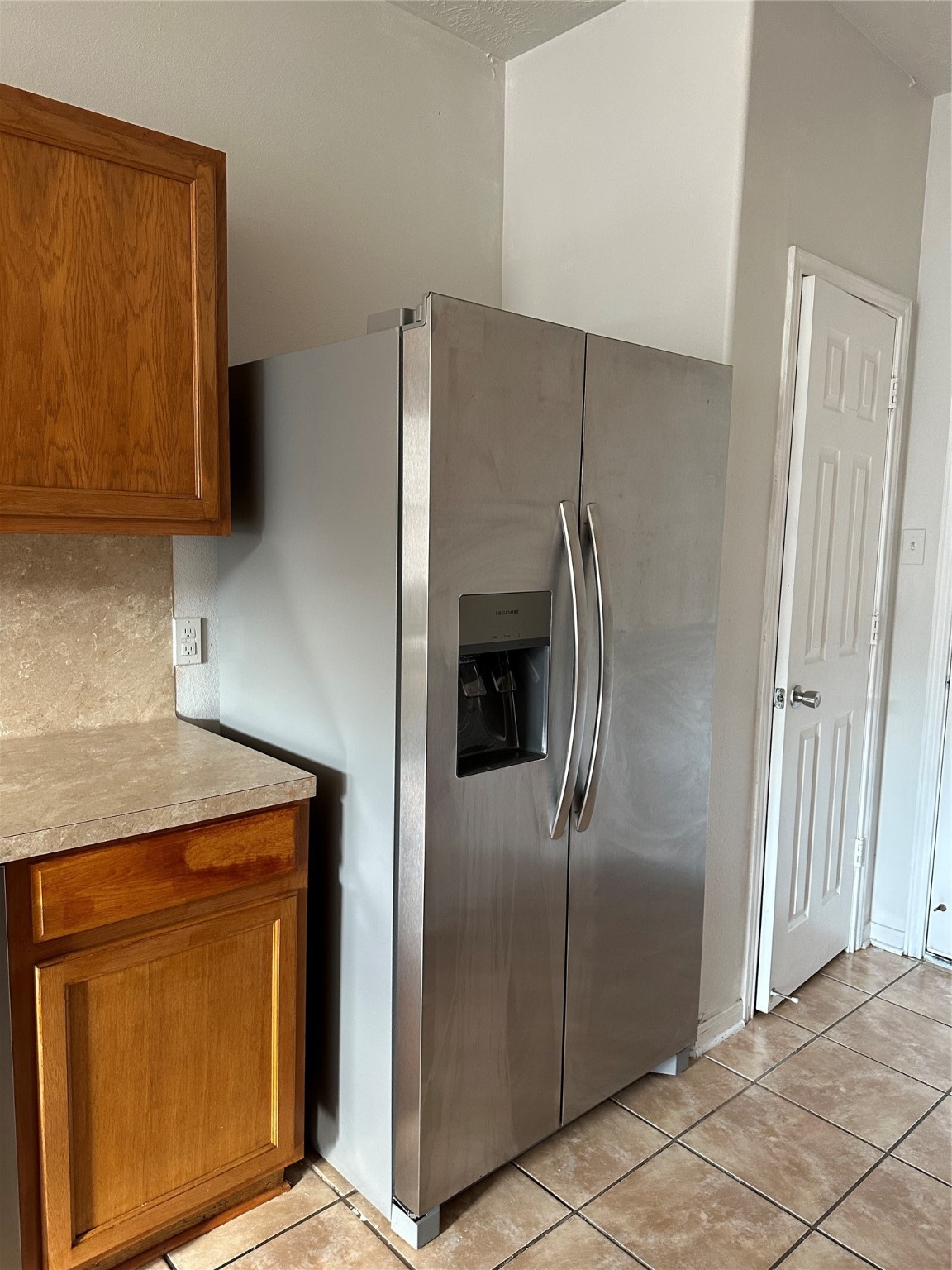 15931 Winston Point Lane Houston, TX 77084 - Photo 7 of 26 a metallic refrigerator freezer sitting in a kitchen