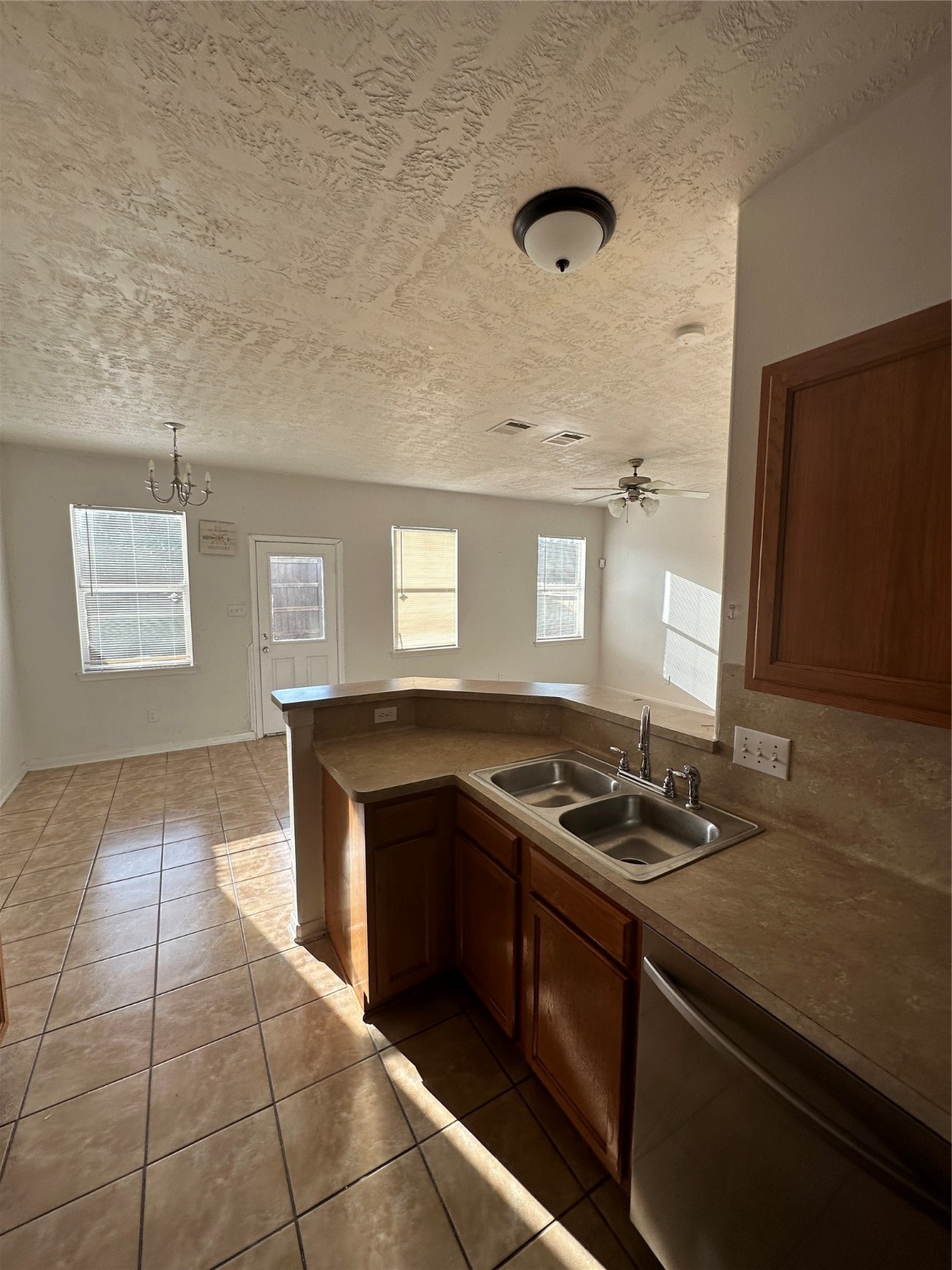 15931 Winston Point Lane Houston, TX 77084 - Photo 9 of 26 a kitchen that has a sink and a stove