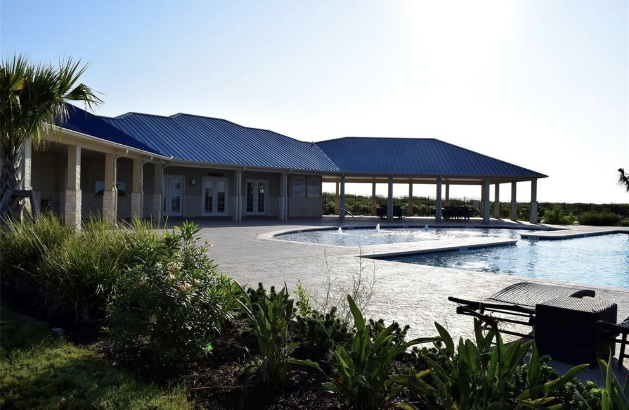 3003 Peninsula Point Drive Palacios, TX 77465 - Photo 17 of 17 a view of house with yard outdoor seating and lake view