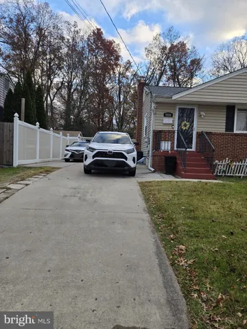 a view of a car parked in front of a house
