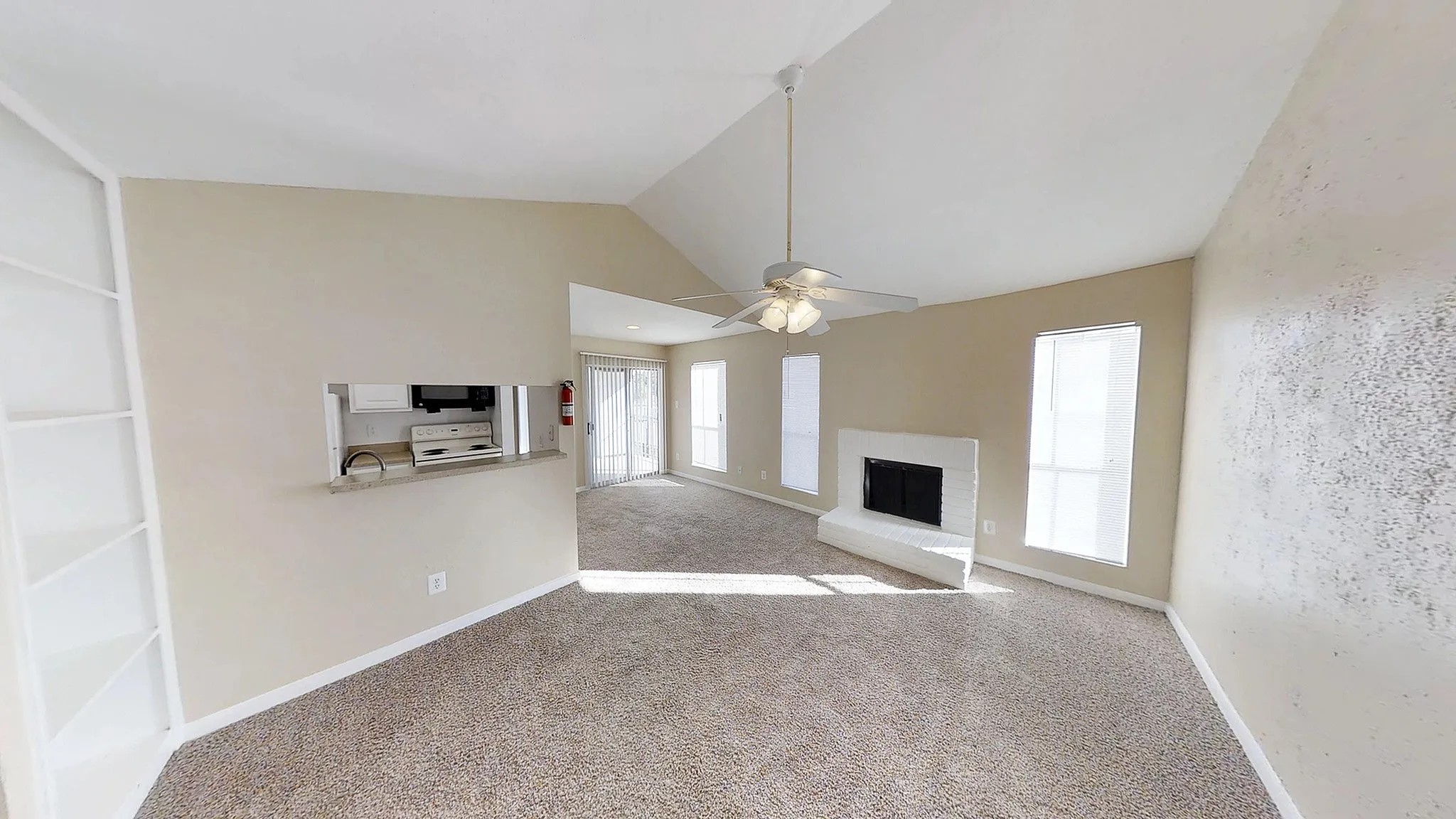 8455 Will Clayton Parkway, Unit 905 Humble, TX 77338 - Photo 19 of 23 a view of a livingroom with a fireplace a chandelier and windows