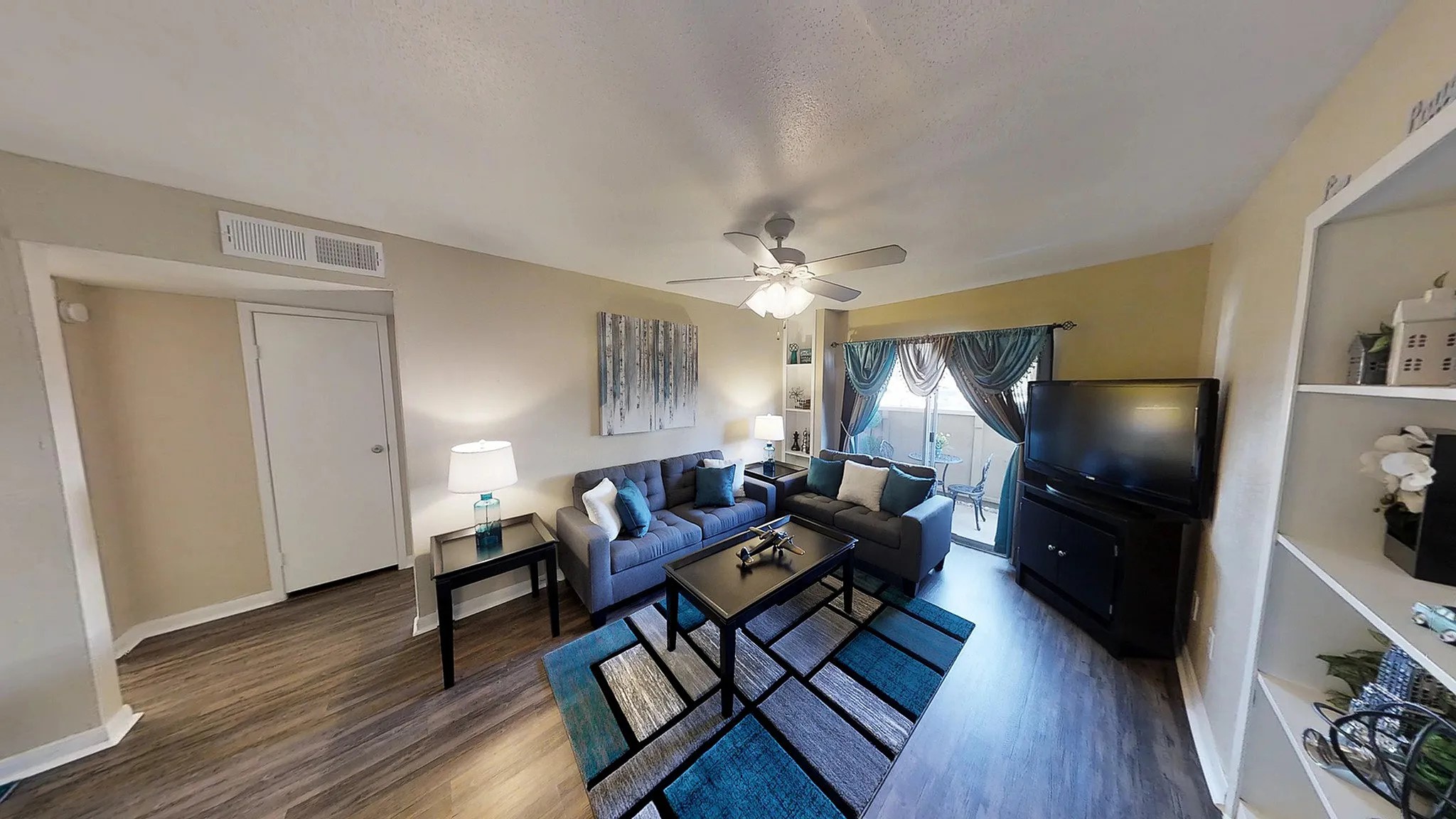 8455 Will Clayton Parkway, Unit 905 Humble, TX 77338 - Photo 3 of 23 a living room with furniture and wooden floor