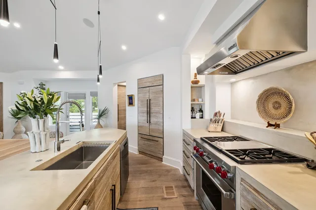 a bedroom with a large bed and a large window