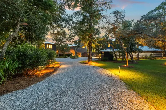 a view of yard with swimming pool and trees