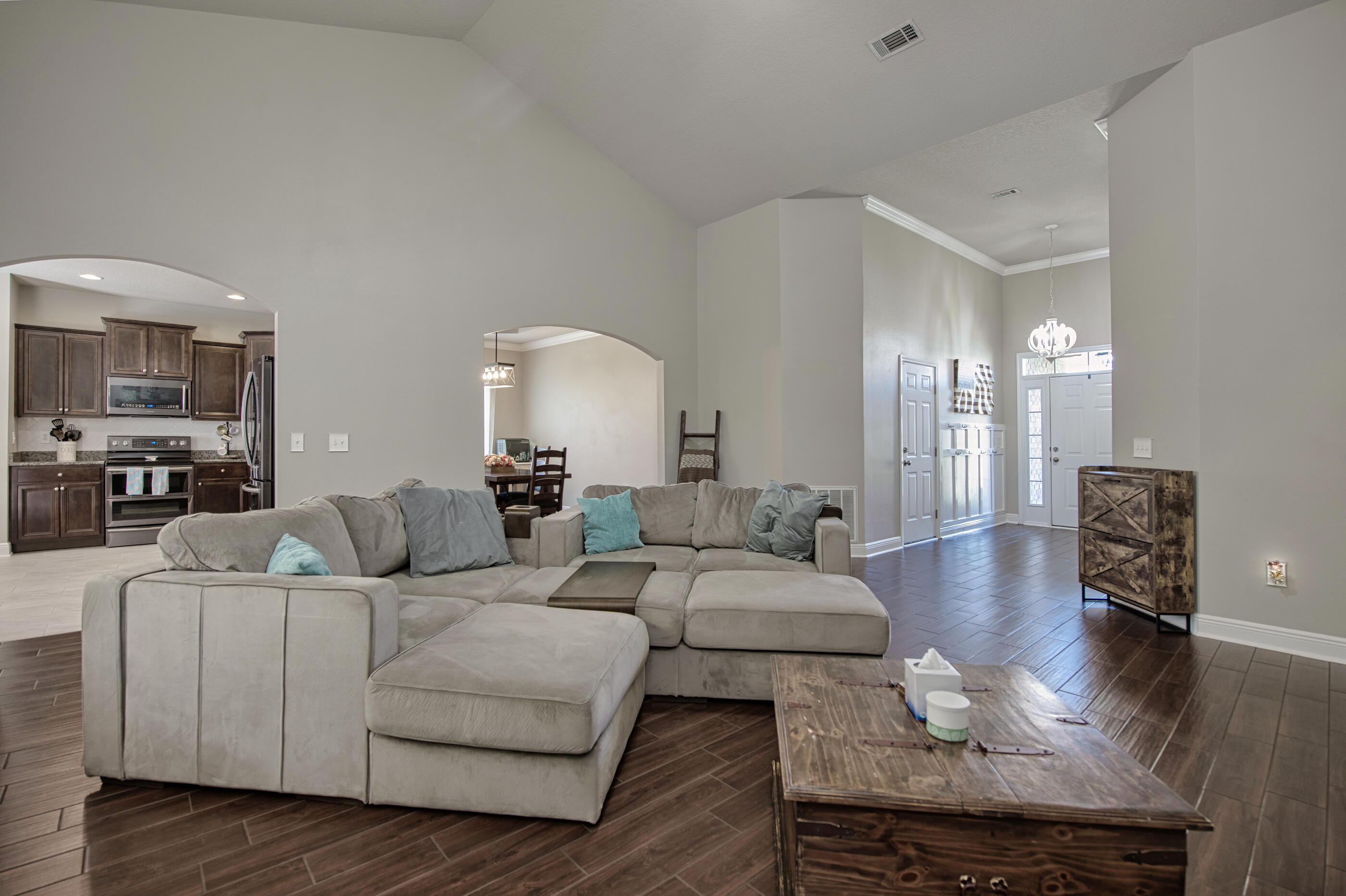 507 Vale Loop Crestview, FL 32536 - Photo 8 of 39 a living room with furniture and a wooden floor