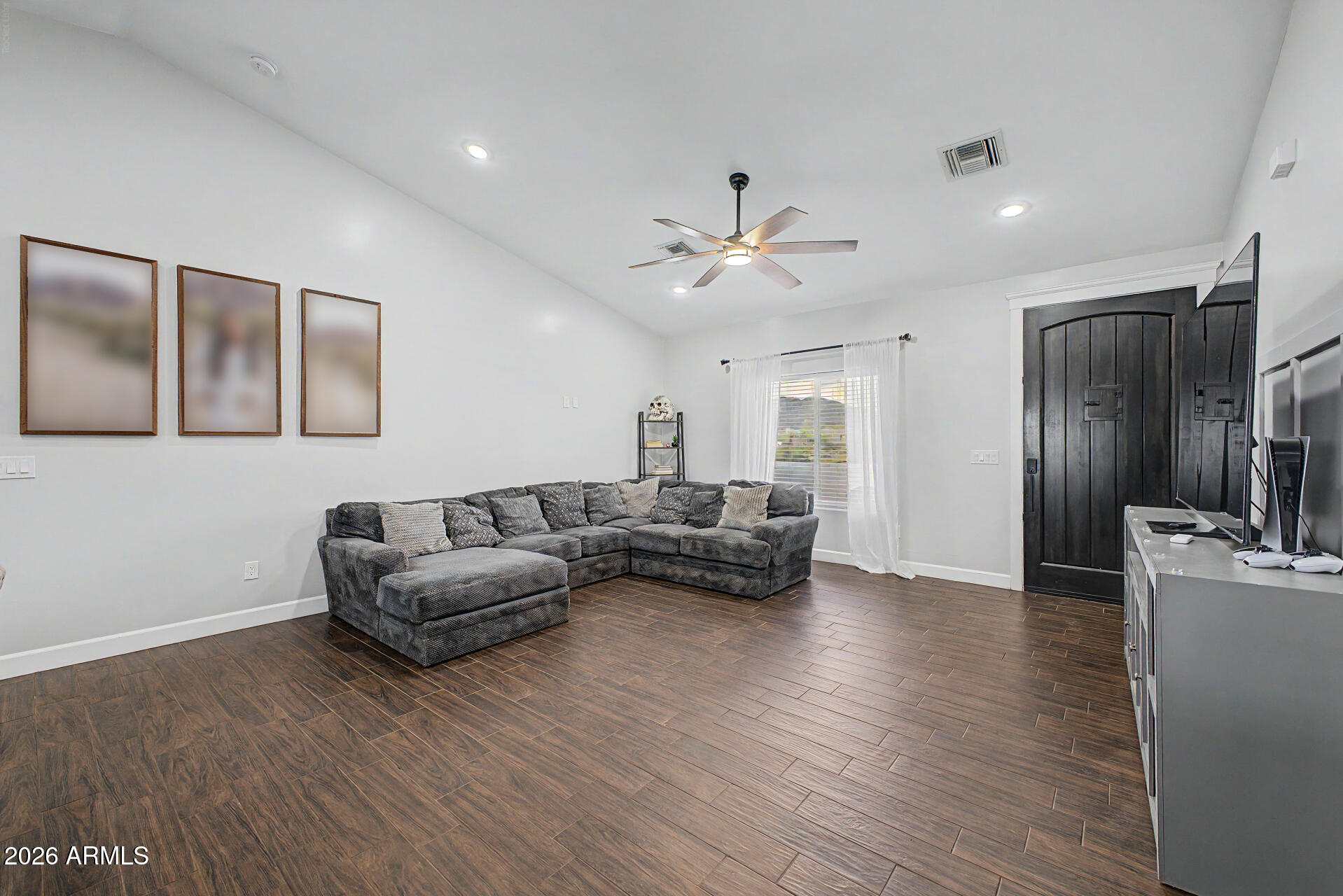 1427 East Whiteley Street Apache Junction, AZ 85119 - Photo 13 of 59 a living room with furniture and a wooden floor