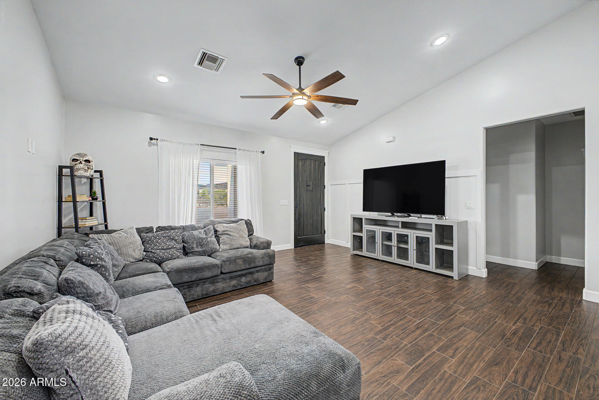 1427 East Whiteley Street Apache Junction, AZ 85119 - Photo 14 of 59 a living room with furniture and a flat screen tv