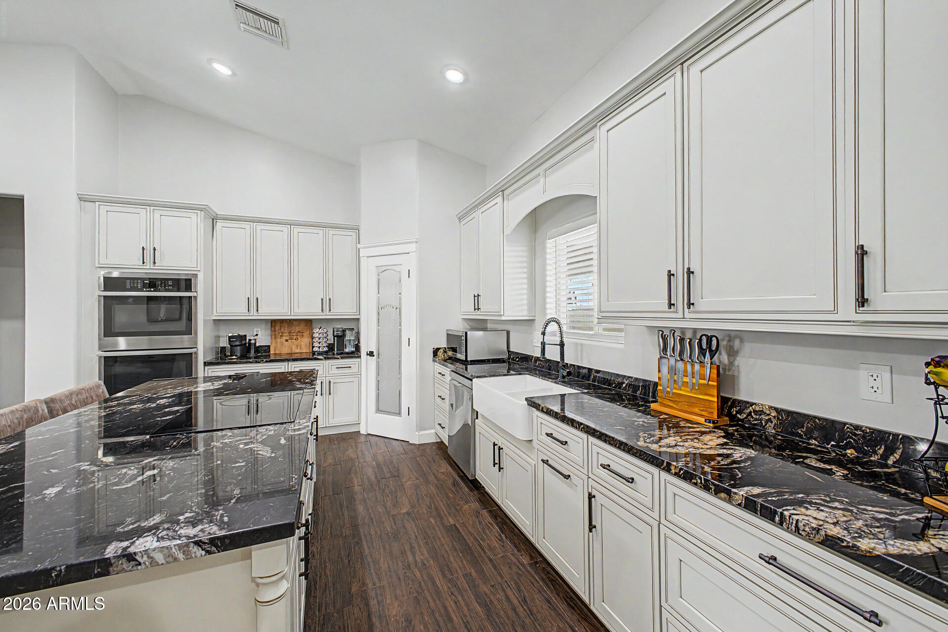 1427 East Whiteley Street Apache Junction, AZ 85119 - Photo 15 of 59 a kitchen with stainless steel appliances granite countertop a stove sink and cabinets