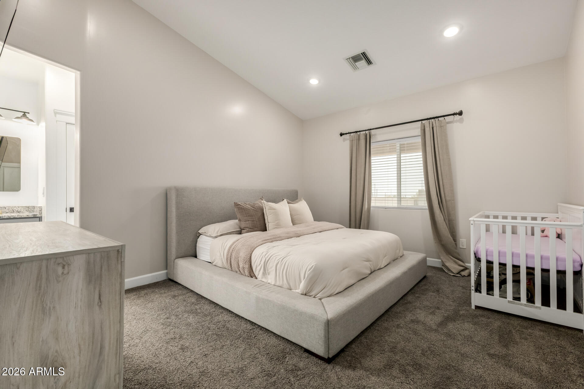 1427 East Whiteley Street Apache Junction, AZ 85119 - Photo 21 of 59 a bed room with a bed and a window