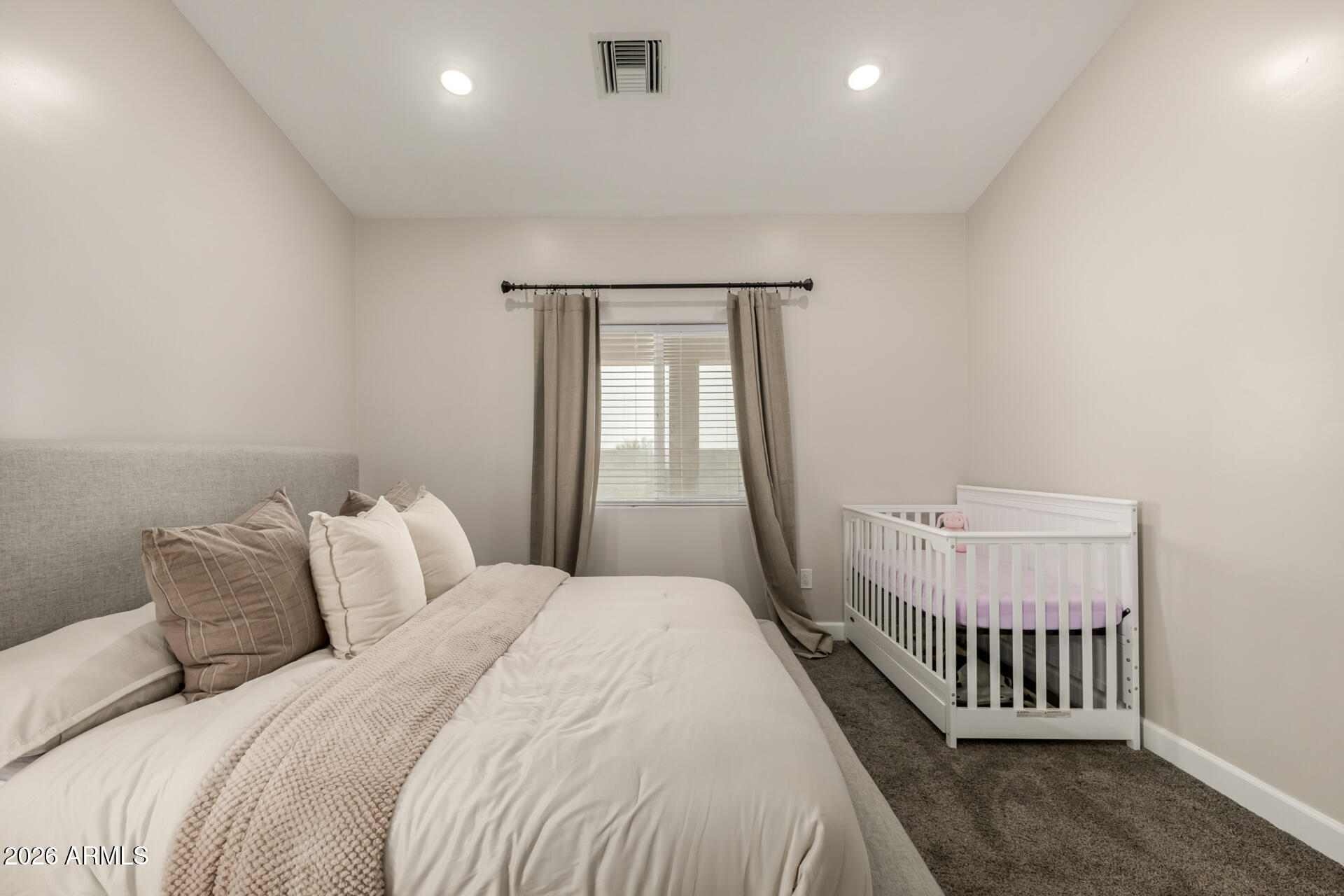 1427 East Whiteley Street Apache Junction, AZ 85119 - Photo 23 of 59 a bedroom with a bed and window