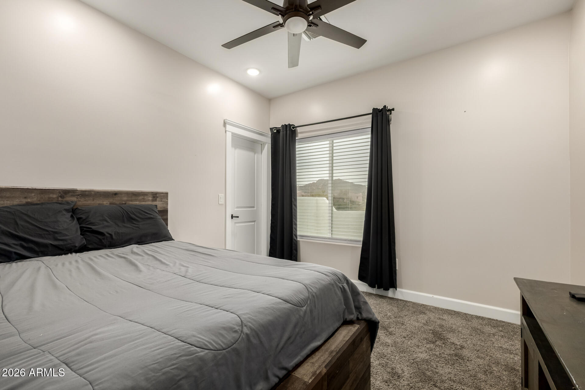 1427 East Whiteley Street Apache Junction, AZ 85119 - Photo 26 of 59 a bedroom with a bed and a window