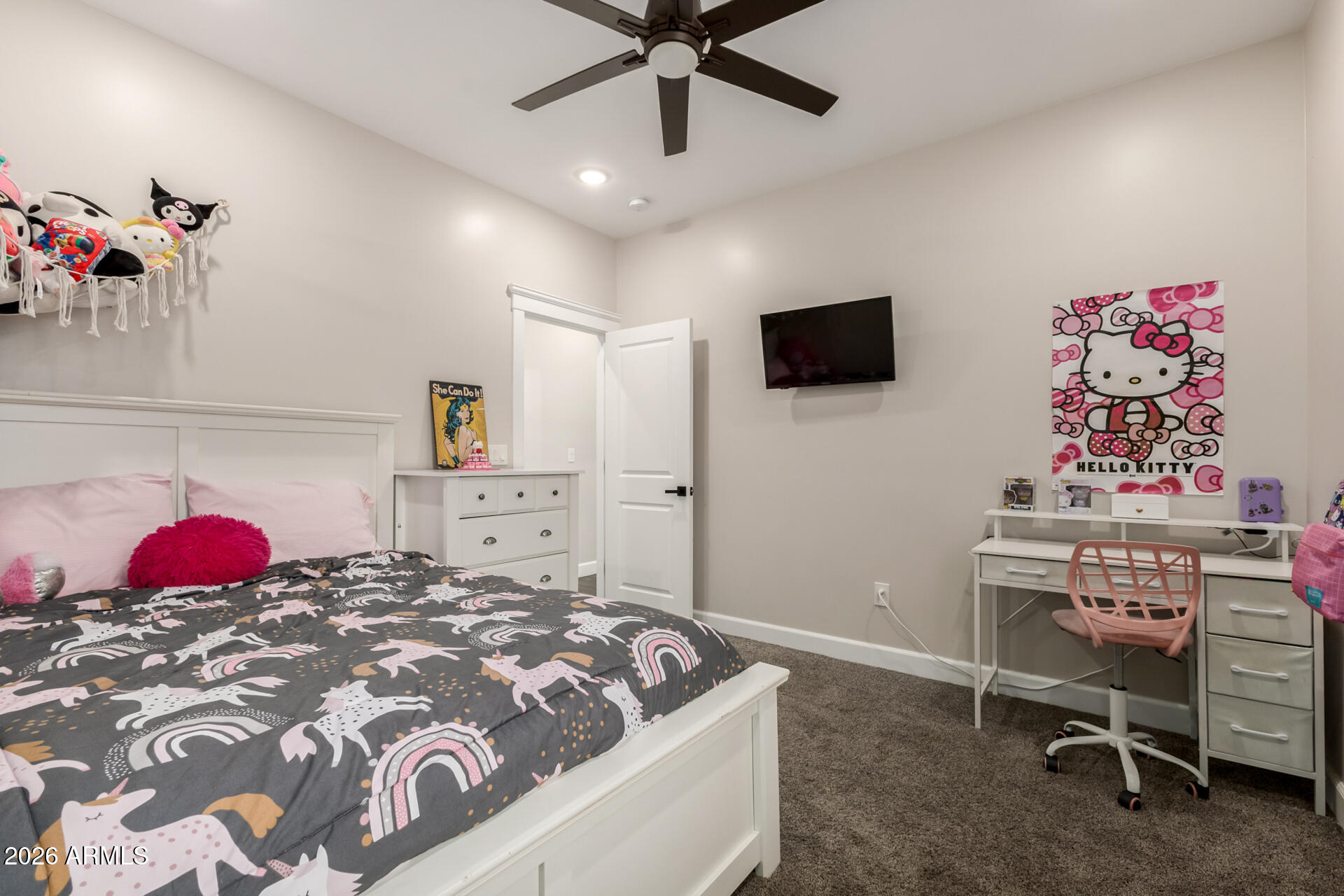 1427 East Whiteley Street Apache Junction, AZ 85119 - Photo 29 of 59 a bedroom with a bed and a flat screen tv
