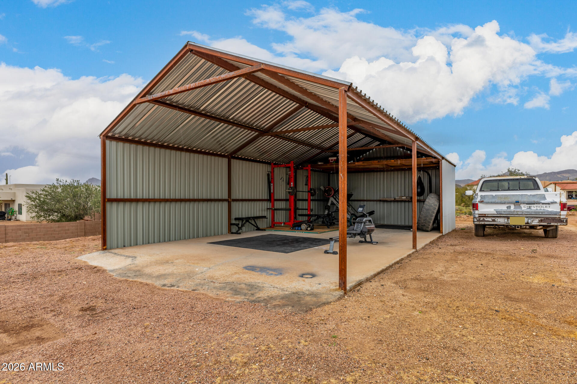 1427 East Whiteley Street Apache Junction, AZ 85119 - Photo 36 of 59 a view of garage and car parked