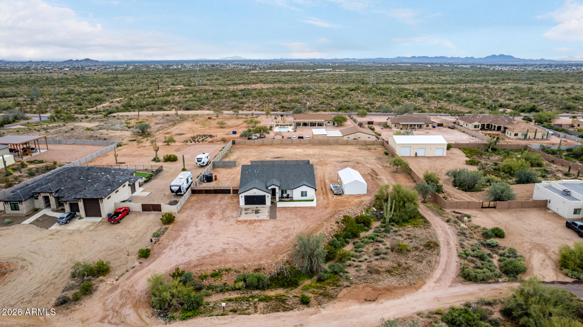 1427 East Whiteley Street Apache Junction, AZ 85119 - Photo 4 of 59 an aerial view of residential houses with outdoor space