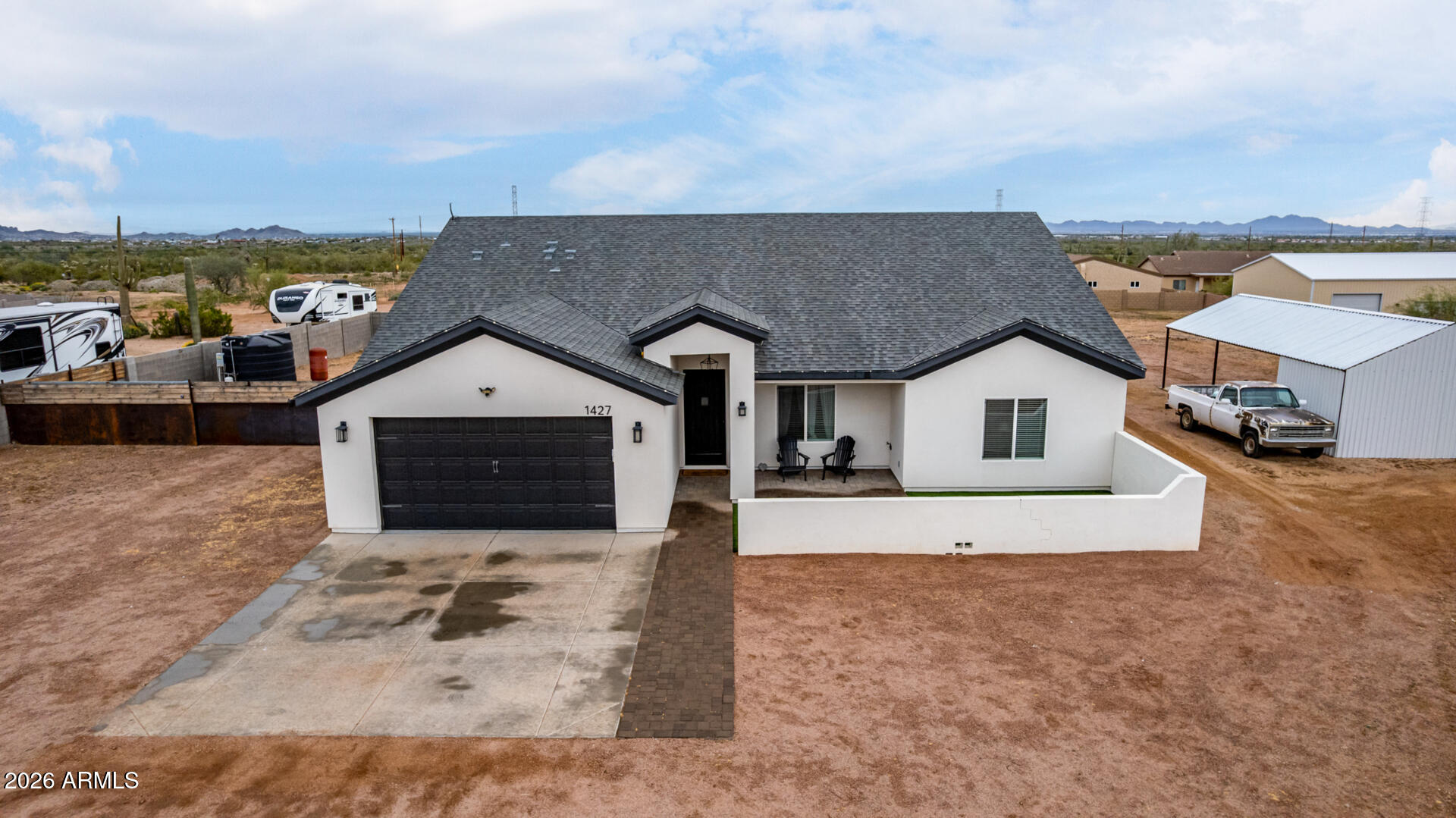 1427 East Whiteley Street Apache Junction, AZ 85119 - Photo 41 of 59 a view of house with yard and ocean view