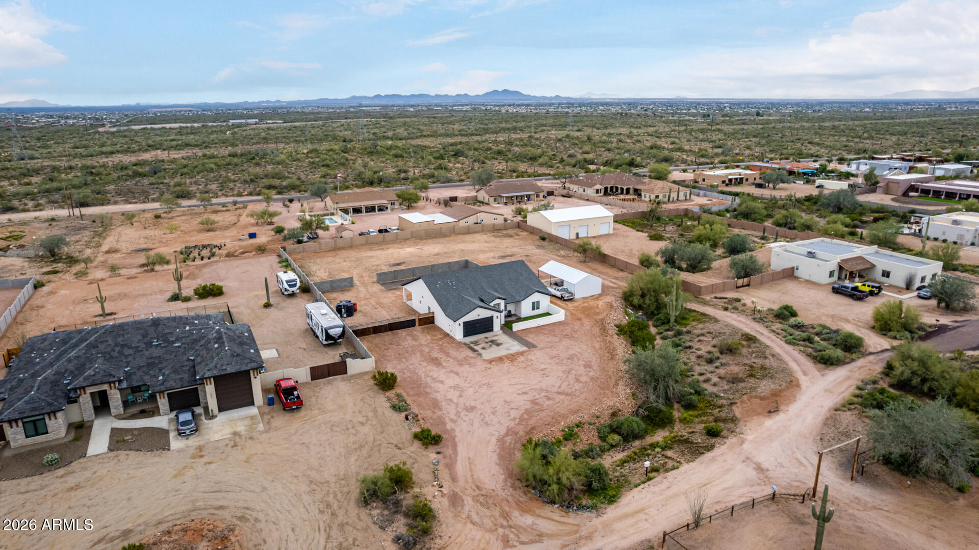 1427 East Whiteley Street Apache Junction, AZ 85119 - Photo 43 of 59 an aerial view of residential houses with outdoor space
