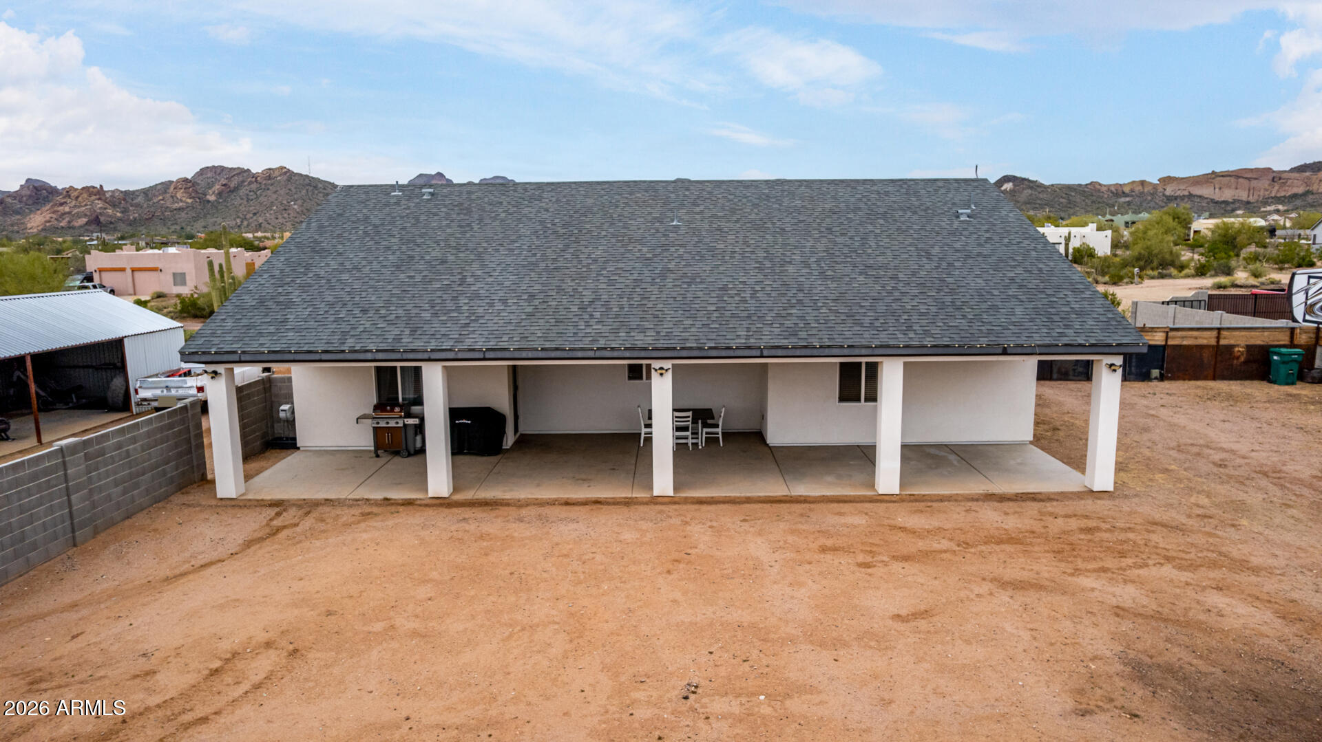 1427 East Whiteley Street Apache Junction, AZ 85119 - Photo 46 of 59 an aerial view of a house with a yard and mountain view in back