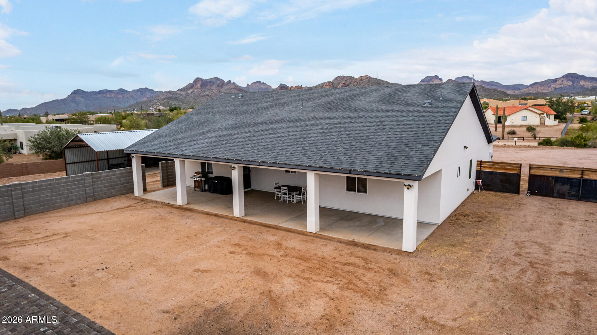 1427 East Whiteley Street Apache Junction, AZ 85119 - Photo 47 of 59 an aerial view of a house with a yard and mountain view in back