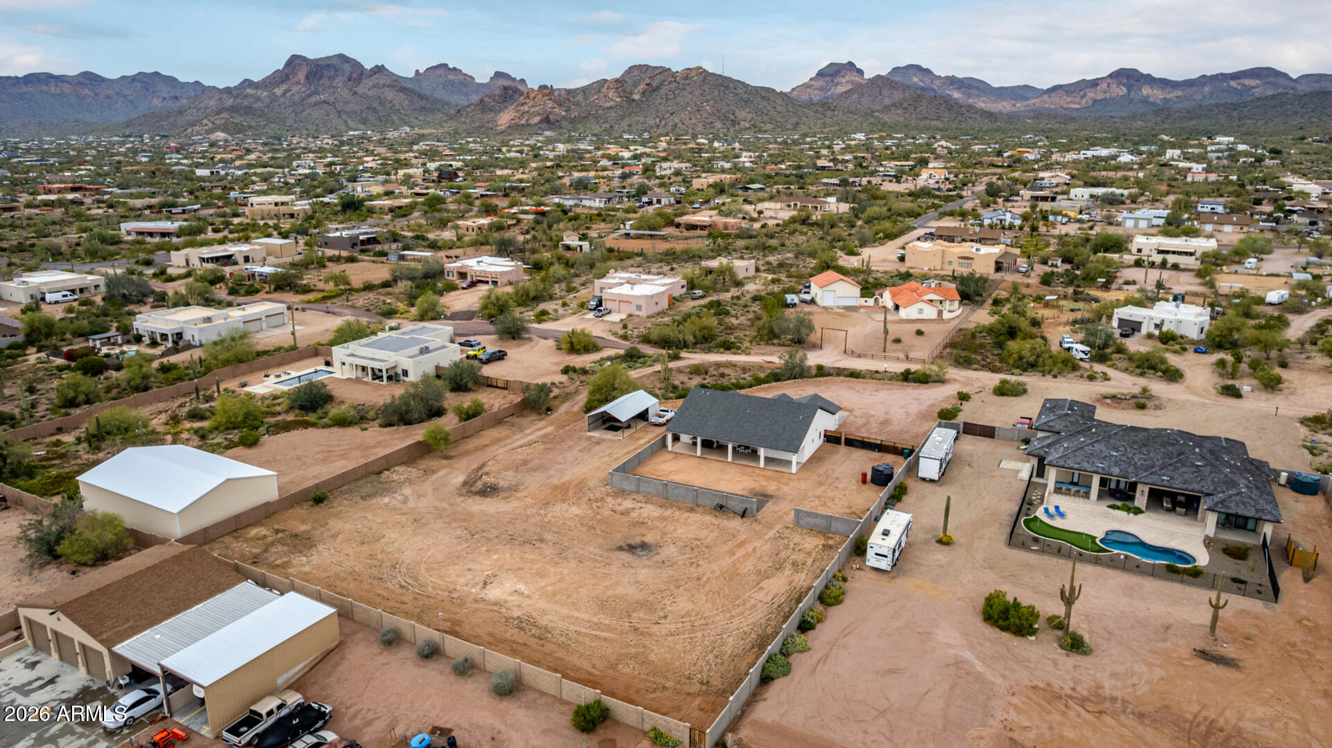 1427 East Whiteley Street Apache Junction, AZ 85119 - Photo 48 of 59 an aerial view of a house with a mountain