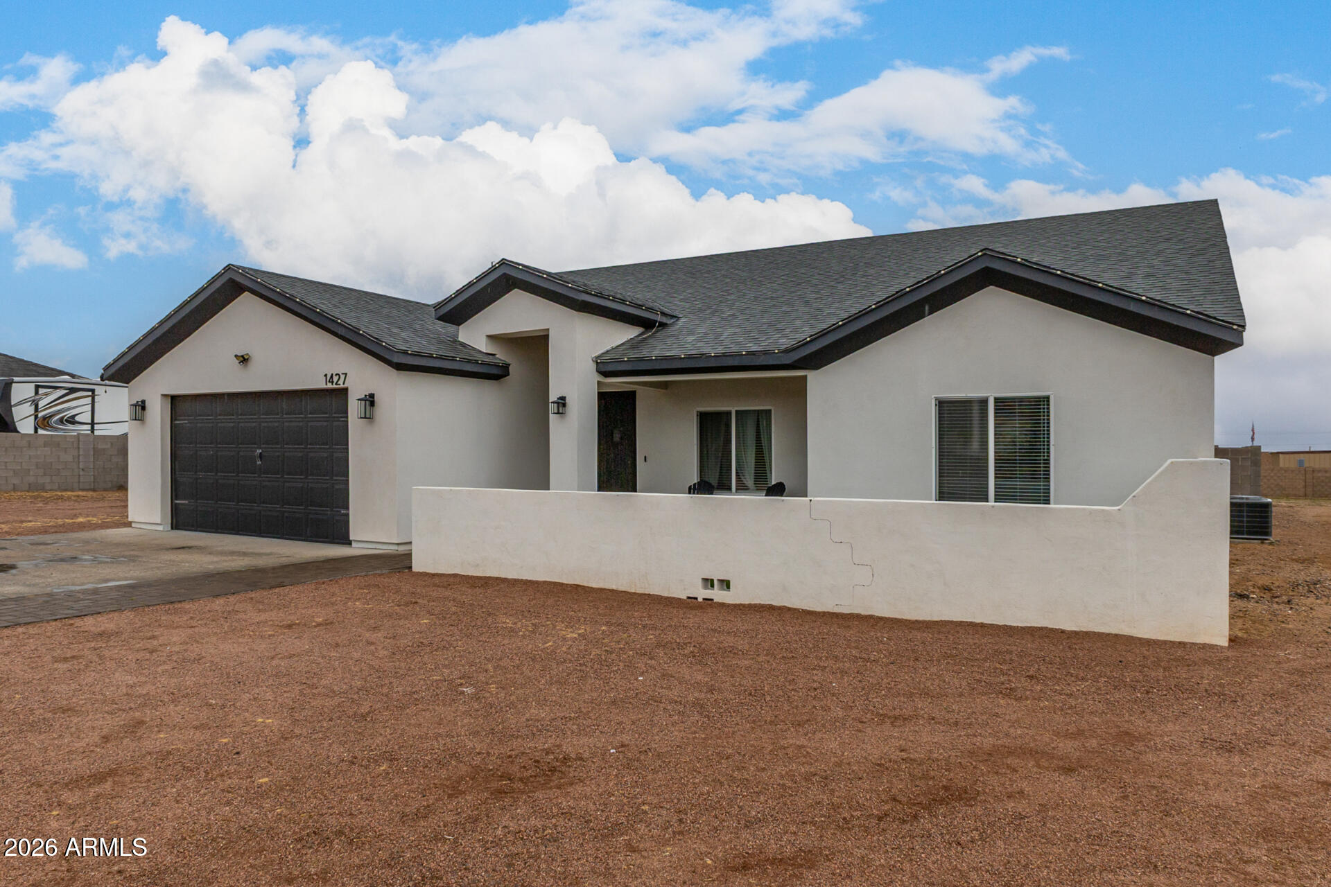 1427 East Whiteley Street Apache Junction, AZ 85119 - Photo 5 of 59 a view of house with yard and garage