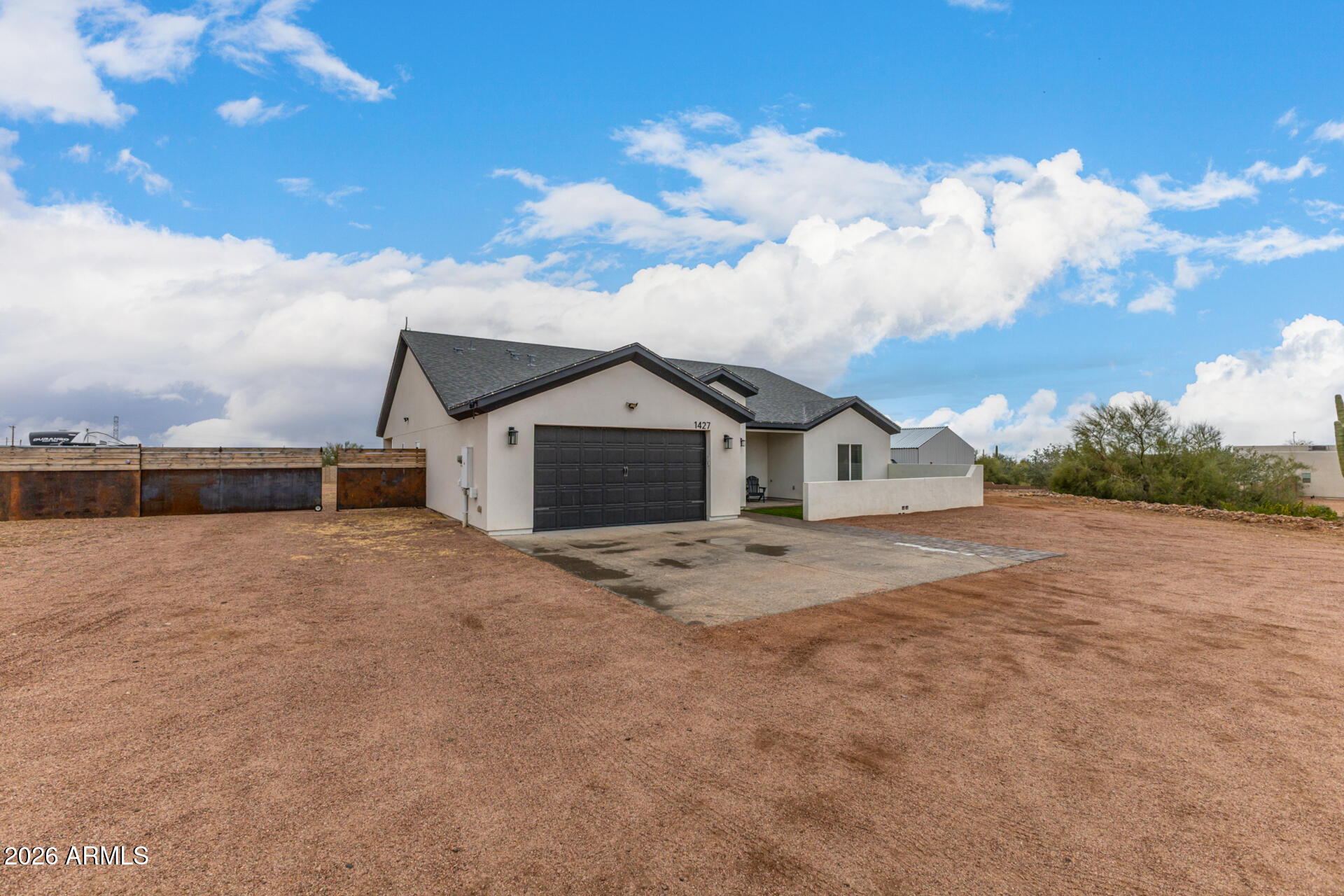 1427 East Whiteley Street Apache Junction, AZ 85119 - Photo 7 of 59 a view of a house with a yard