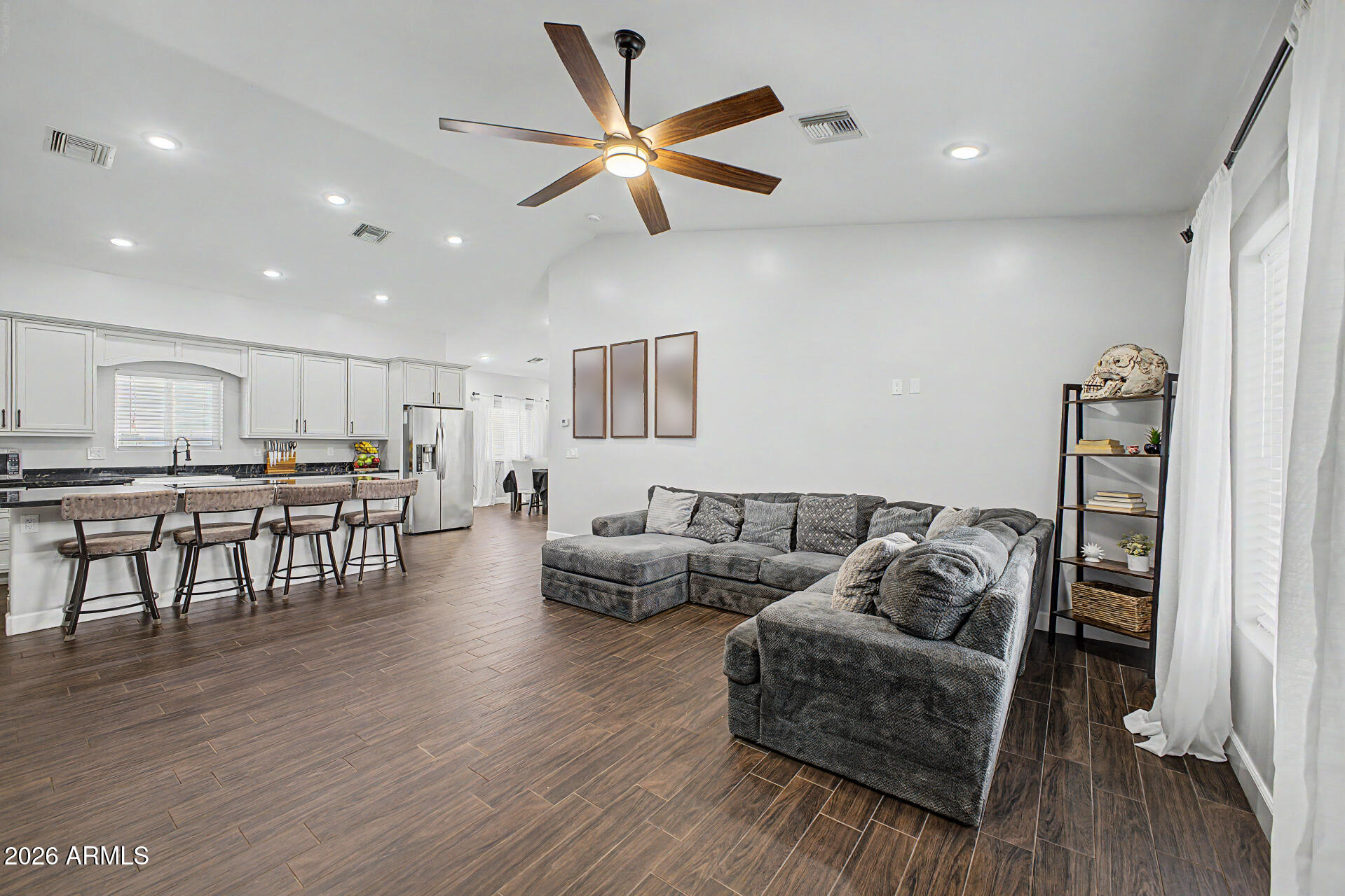 1427 East Whiteley Street Apache Junction, AZ 85119 - Photo 8 of 59 a living room with furniture and kitchen view