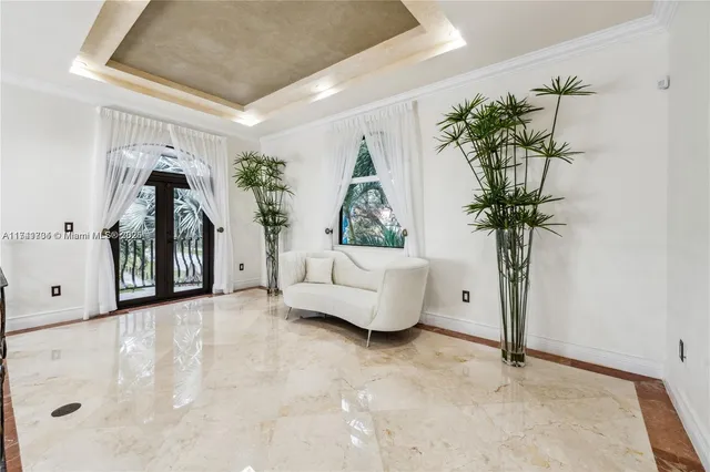 a living room with furniture a rug and a window