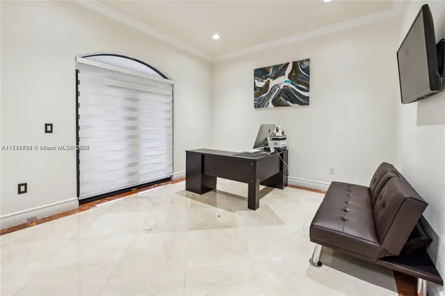 a bedroom with a bed and a night stand