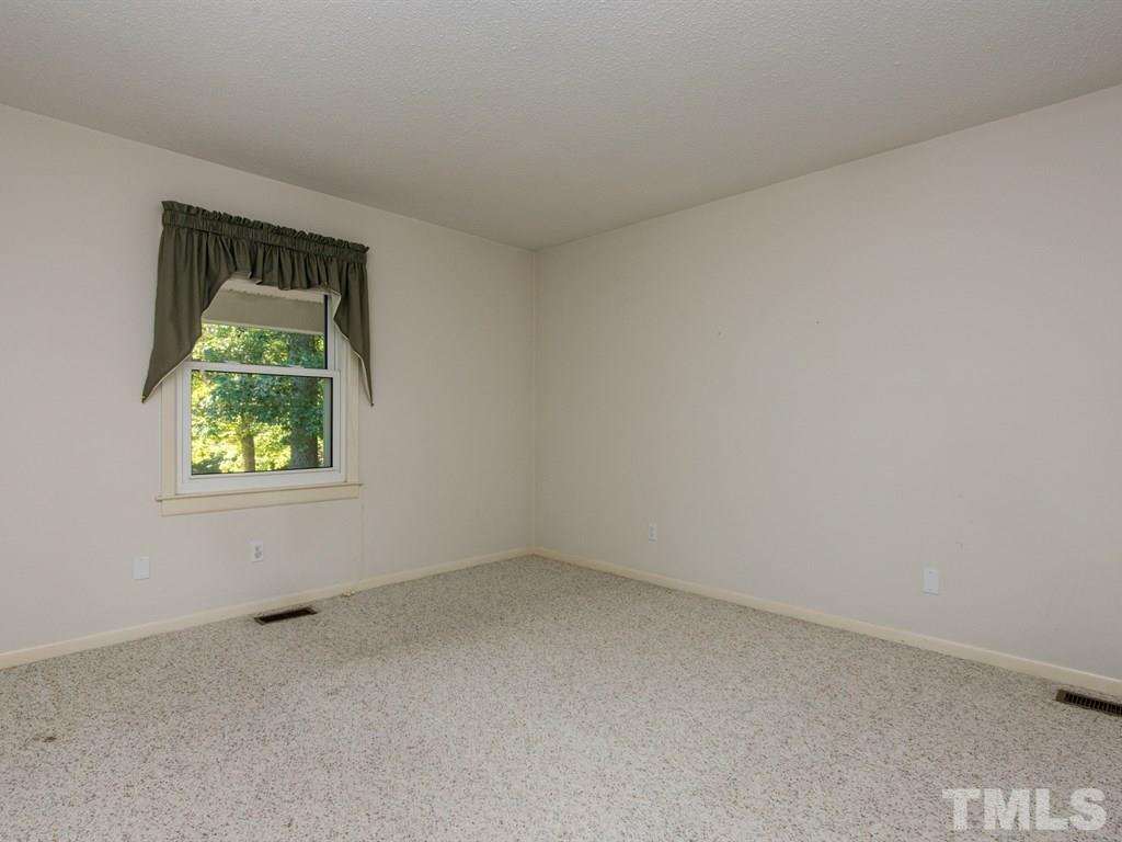 3811 Donna Road Raleigh, NC 27604 - Photo 13 of 25 an empty room with a window