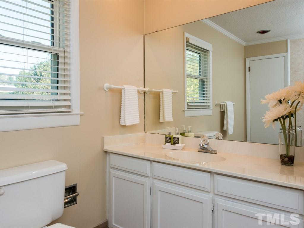 3811 Donna Road Raleigh, NC 27604 - Photo 16 of 25 a bathroom with a sink and a toilet