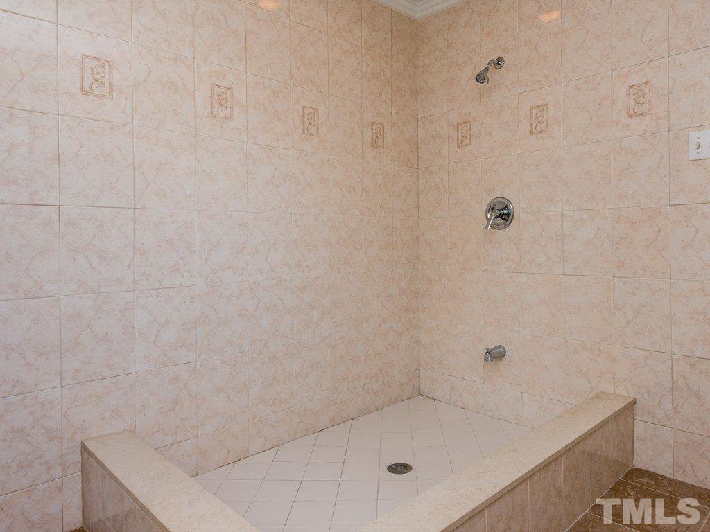 3811 Donna Road Raleigh, NC 27604 - Photo 17 of 25 a bathroom with a bath tub
