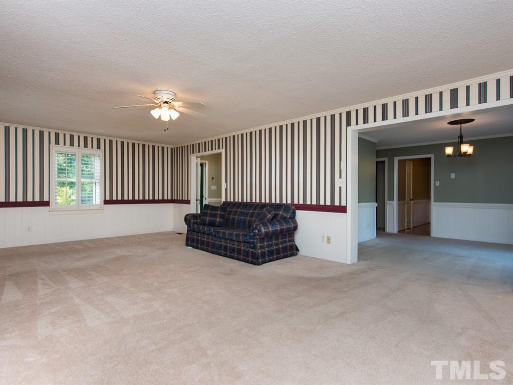 3811 Donna Road Raleigh, NC 27604 - Photo 10 of 25 a view of a livingroom with a staircase