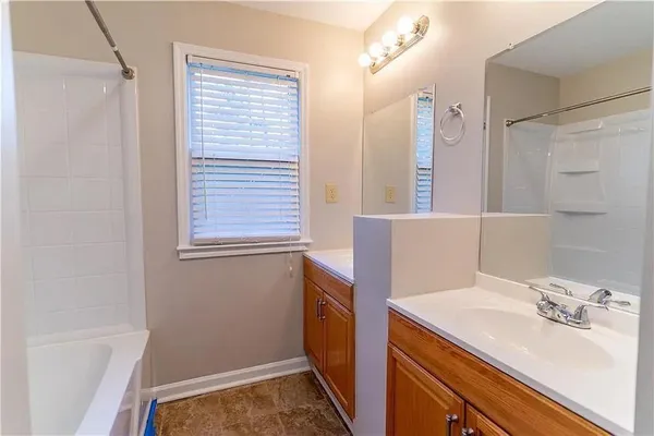 a bathroom with a sink a vanity and a mirror