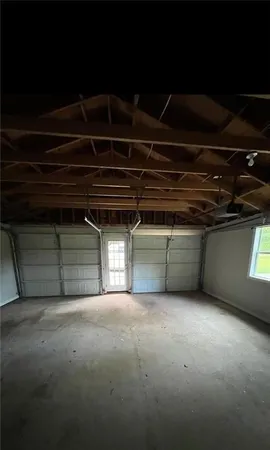 a view of an empty room with a fireplace
