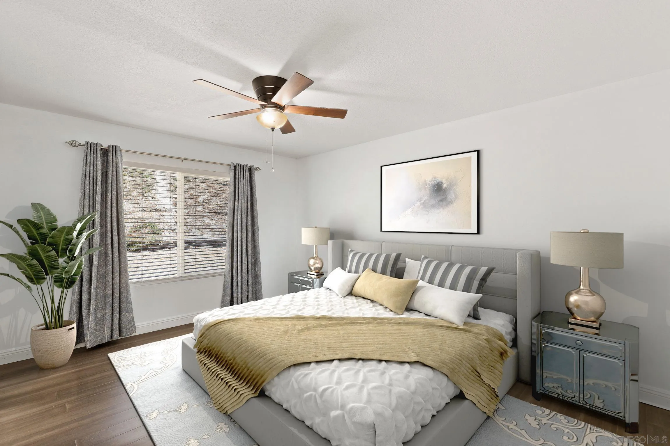 4141 Bryan Street Oceanside, CA 92056 - Photo 12 of 22 a bedroom with a large bed and a chandelier fan