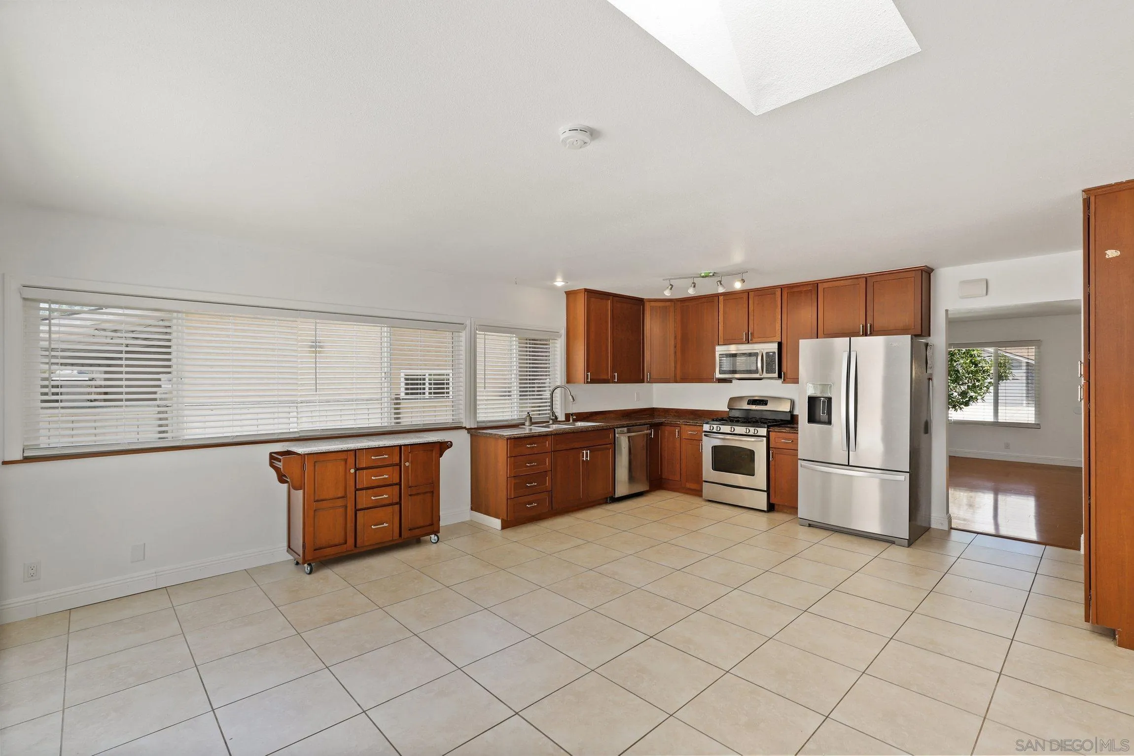 4141 Bryan Street Oceanside, CA 92056 - Photo 8 of 22 a large kitchen with stainless steel appliances and cabinets