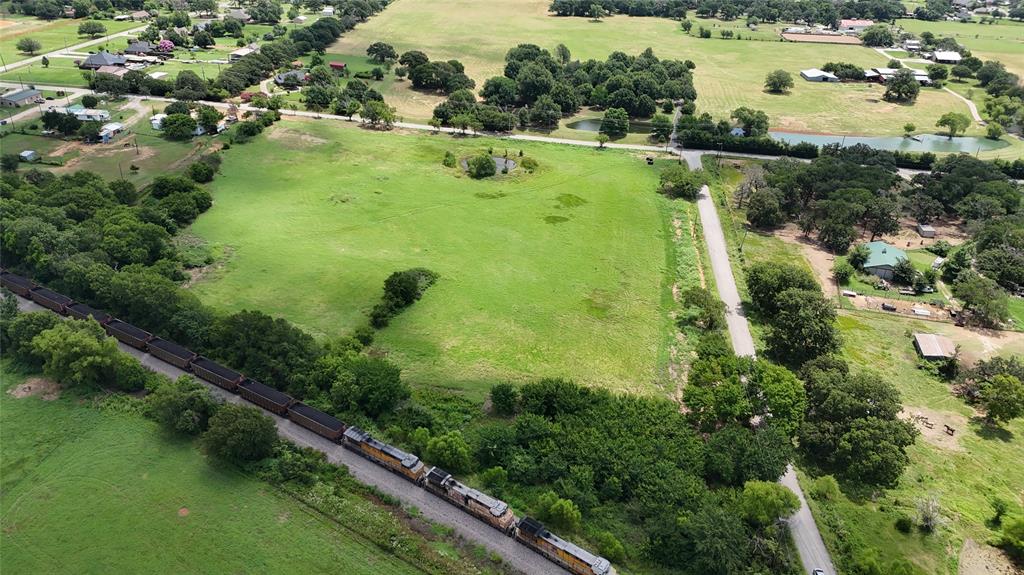 Lot 4 New Hope Road Aubrey, TX 76227 - Photo 6 of 7 an aerial view of residential houses with outdoor space and trees all around