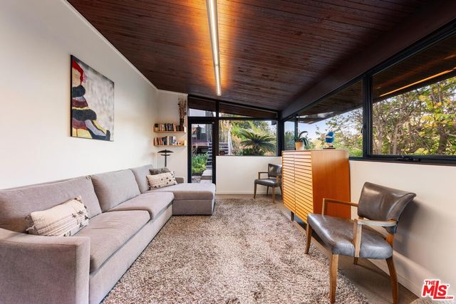 a living room with furniture a couch and a table