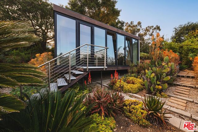a view of a house with a tree