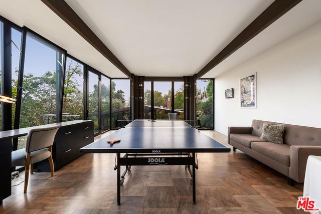 a view of a living room and furniture in a room